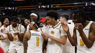 Mar 16, 2025; Washington, D.C., USA; VCU Rams players celebrate on court after their game against the George Mason Patriots at Capital One Arena. Mandatory Credit: Geoff Burke-Imagn Images