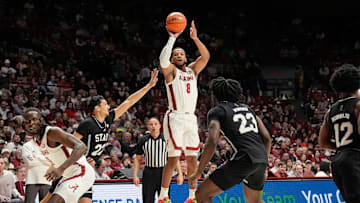 Feb 25, 2025; Tuscaloosa, AL, USA; Alabama guard Chris Youngblood (8) shoots a three and is defended by Mississippi State forward RJ Melendez (22) at Coleman Coliseum. Mandatory Credit: Gary Cosby Jr.-Tuscaloosa News