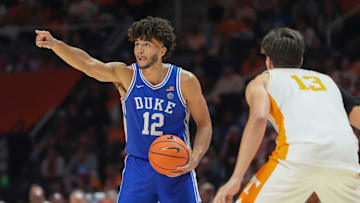 Duke forward Cameron Boozer (12) sends out instructions while guarded by Tennessee forward J.P. Estrella (13) during a college basketball exhibition game between on October 26, 2025, in Knoxville, Tenn.