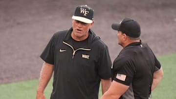 Wake Forest baseball coach Tom Walter talks to the umpire at the NCAA college baseball Knoxville Regional final againstTennessee on June 1, 2025, in Knoxville, Tenn.
