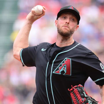 Aug 25, 2024; Boston, Massachusetts, USA; Arizona Diamondbacks starting pitcher Merrill Kelly (29) pitches against the Boston Red Sox during the first inning at Fenway Park. Mandatory Credit: Eric Canha-USA TODAY Sports