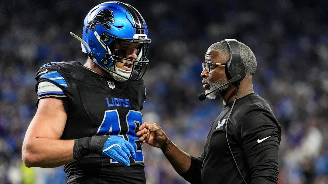 Detroit Lions defensive coordinator Aaron Glenn talks with linebacker Jack Campbell during the first half against the Minnesota Vikings at Ford Field in Detroit on Sunday, Jan. 5, 2025.
