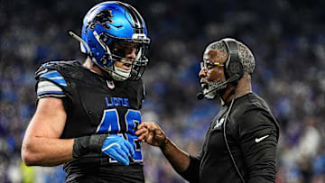 Detroit Lions defensive coordinator Aaron Glenn talks with linebacker Jack Campbell during the first half against the Minnesota Vikings at Ford Field in Detroit on Sunday, Jan. 5, 2025.