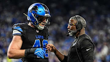 Detroit Lions defensive coordinator Aaron Glenn talks with linebacker Jack Campbell during the first half against the Minnesota Vikings at Ford Field in Detroit on Sunday, Jan. 5, 2025.