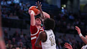 Feb 12, 2025; Atlanta, Georgia, USA; Stanford Cardinal forward Maxime Raynaud (42) is defended by Georgia Tech Yellow Jackets forward Baye Ndongo (11) in the first half at McCamish Pavilion. Mandatory Credit: Brett Davis-Imagn Images
