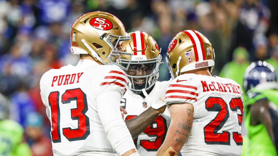 San Francisco 49ers running back Christian McCaffrey (23) with quarterback Brock Purdy (13) and wide receiver Deebo Samuel (19)