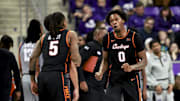 Feb 12, 2025; Fort Worth, Texas, USA; Oklahoma State Cowboys forward Marchelus Avery (0) celebrates with Oklahoma State Cowboys guard Khalil Brantley (5) during the second half against the TCU Horned Frogs at Ed and Rae Schollmaier Arena. Mandatory Credit: Kevin Jairaj-Imagn Images