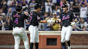 Jun 28, 2024; New York City, New York, USA;  New York Mets second baseman Jeff McNeil (1) is greeted by third baseman Mark Vientos (27) and catcher Francisco Alvarez (4) after hitting a three-run home run in the sixth inning against the Houston Astros at Citi Field. Mandatory Credit: Wendell Cruz-Imagn Images