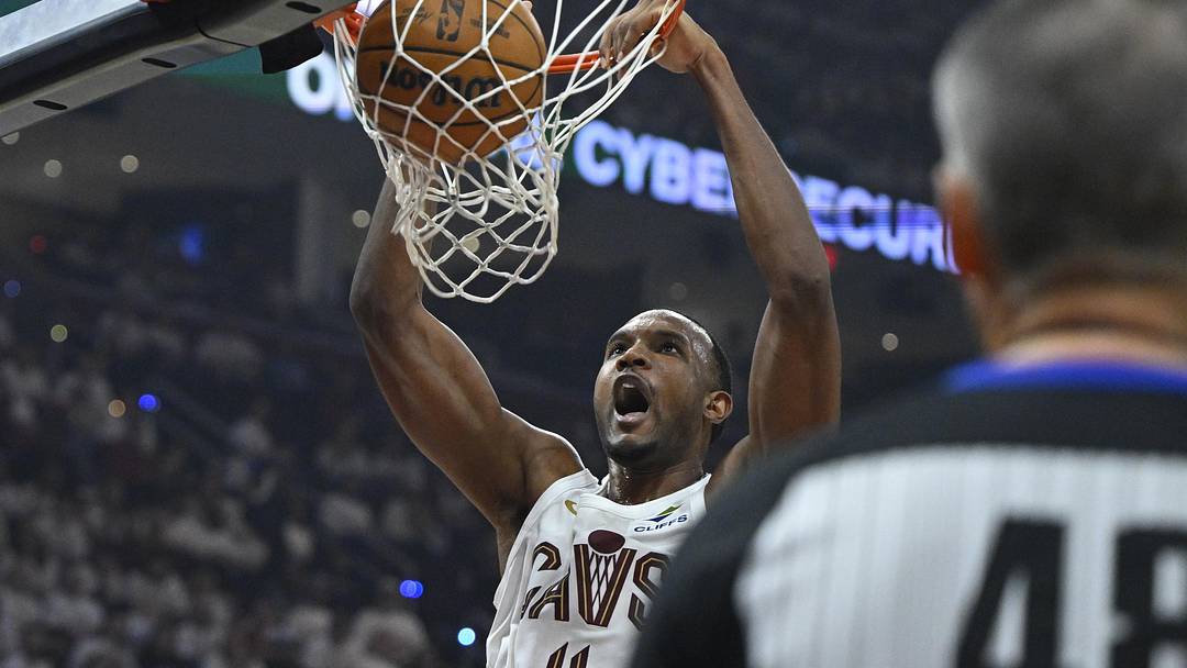 Apr 29, 2026; Cleveland, Ohio, USA; Cleveland Cavaliers center Evan Mobley (4) dunks against the Toronto Raptors in the third quarter of game five of the first round of the 2026 NBA Playoffs at Rocket Arena. Mandatory Credit: David Richard-Imagn Images