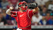 Cincinnati Reds catcher Curt Casali (12) returns the ball in the ninth inning of the MLB National League game between the Cincinnati Reds and the LA Dodgers at Great American Ball Park in downtown Cincinnati on Tuesday, June 6, 2023. The Reds won 9-8 on a walk-off, bases loaded, single off the bat of shortstop Matt McLain (9) in the bottom of the ninth.