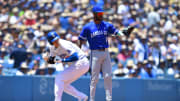 Jun 16, 2024; Los Angeles, California, USA; Los Angeles Dodgers designated hitter Shohei Ohtani (17) reaches third against Kansas City Royals third baseman Maikel Garcia (11) during the first inning at Dodger Stadium. 