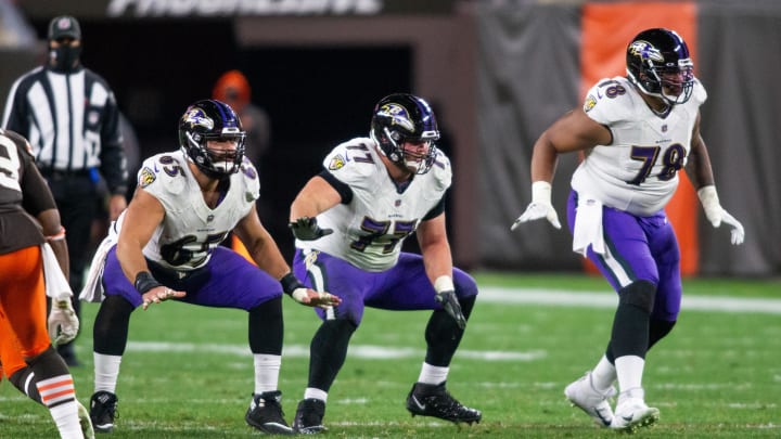 Dec 14, 2020; Cleveland, Ohio, USA; Baltimore Ravens center Patrick Mekari (65) along with offensive guard Bradley Bozeman (77) and offensive tackle Orlando Brown (78) at the line of scrimmage against the Cleveland Browns during the fourth quarter at FirstEnergy Stadium. Mandatory Credit: Scott Galvin-USA TODAY Sports