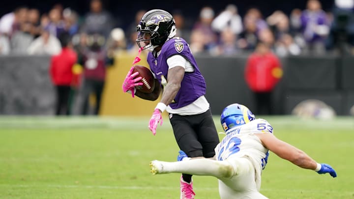 Oct 12, 2025; Baltimore, Maryland, USA; Los Angeles Rams linebacker Nate Landman (53) tackles Baltimore Ravens wide receiver Zay Flowers (4) during the second quarter of the game at M&T Bank Stadium. Mandatory Credit: Mitch Stringer-Imagn Images Oct 12, 2025; Baltimore, Maryland, USA; Los Angeles Rams linebacker Nate Landman (53) tackles Baltimore Ravens wide receiver Zay Flowers (4) during the second quarter of the game at M&T Bank Stadium. Mandatory Credit: Mitch Stringer-Imagn Images