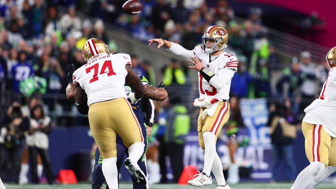Jan 17, 2026; Seattle, WA, USA; San Francisco 49ers quarterback Brock Purdy (13) throws a pass against the Seattle Seahawks during the first half in an NFC Divisional Round game at Lumen Field. Mandatory Credit: Kevin Ng-Imagn Images