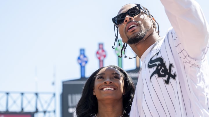 Apr 13, 2024: Chicago Bears safety Jonathan Owens and American gymnast Simone Biles take a selfie prior to a game between the Chicago White Sox and the Cincinnati Reds at Guaranteed Rate Field.