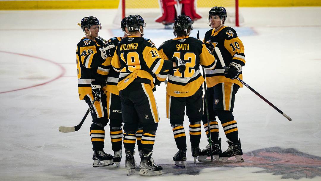 The Wilkes-Barre/Scranton Penguins celebrate Ty Smith's (42) goal against the Utica Comets on Monday, October 17, 2022 at the Adirondack Bank Center in Utica.

Smith Utica Comets Vs Wilkes Barre Scranton Penguins