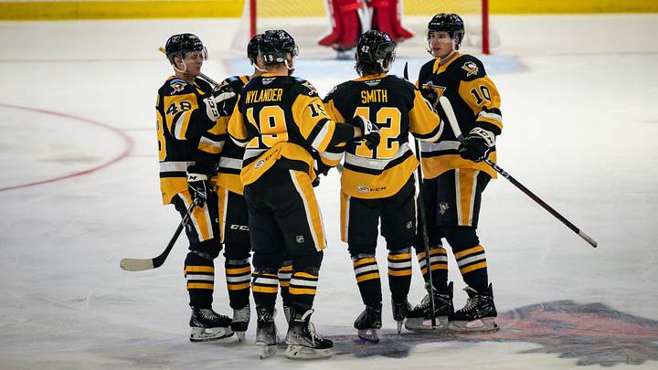 The Wilkes-Barre/Scranton Penguins celebrate Ty Smith's (42) goal against the Utica Comets on Monday, October 17, 2022 at the Adirondack Bank Center in Utica.

Smith Utica Comets Vs Wilkes Barre Scranton Penguins