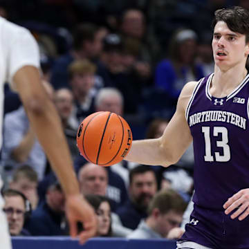 Jan 2, 2025; University Park, Pennsylvania, USA; Northwestern Wildcats guard Brooks Barnhizer (13) dribbles during the second half against the Penn State Nittany Lions at Bryce Jordan Center. Penn State defeated Northwestern 84-80. Mandatory Credit: Matthew O'Haren-Imagn Images