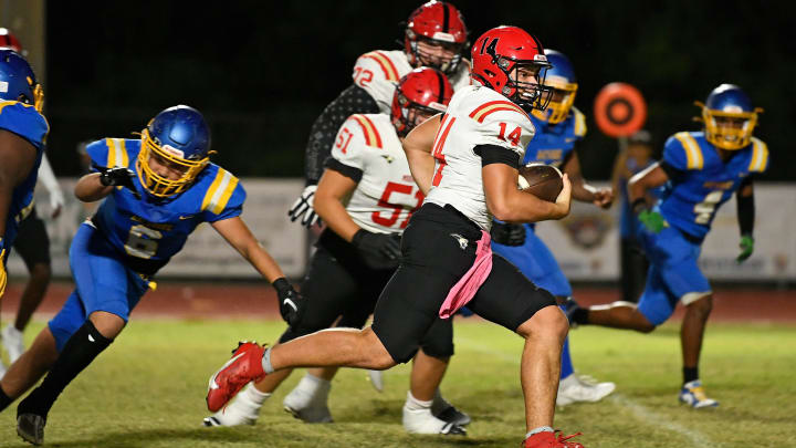 Cardinal Mooney's quarterback Devin Mignery (#14) scores his second touchdown of the evening. Cardinal Mooney Cougars with a big win 50-0 over the Bayshore Bruins, Friday night, Nov. 3, 2023, at Balvanz Stadium in Bradenton.