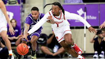 Feb 24, 2024; Fort Worth, Texas, USA; TCU Horned Frogs guard Avery Anderson III (3) and Cincinnati Bearcats guard Day Day Thomas (1) go for a loose ball during the second half at Ed and Rae Schollmaier Arena. Mandatory Credit: Kevin Jairaj-Imagn Images