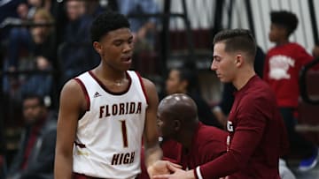 Florida High sophomore Jaylen Martin gets a high five while subbing out as Florida High's boys basketball team beat Maclay 65-58 during the District 1-3A final on Feb. 14, 2020.

Cc2v2961
