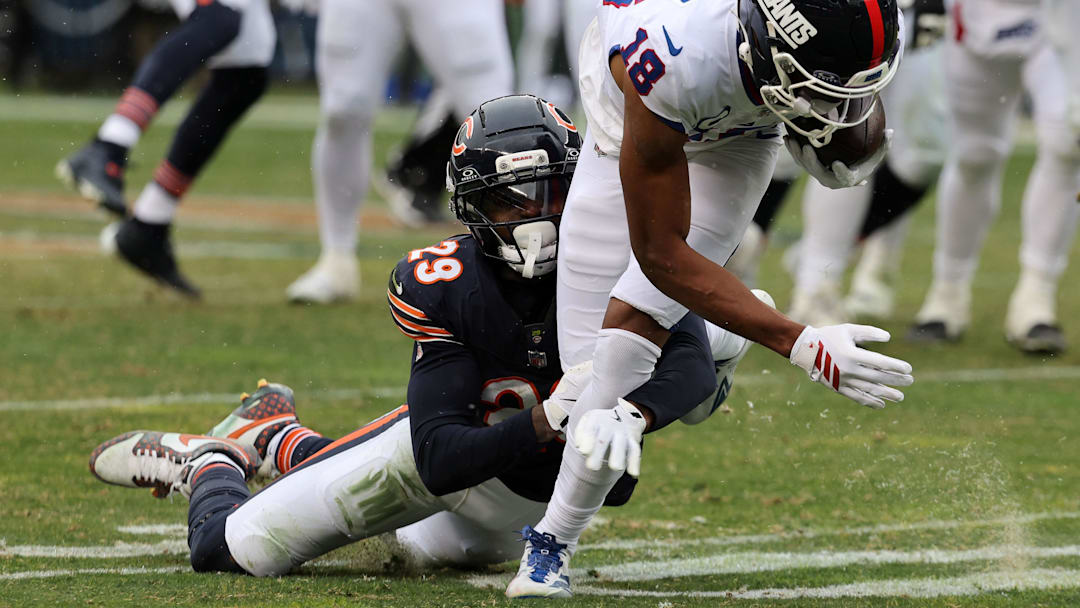 Nov 9, 2025; Chicago, Illinois, USA; New York Giants wide receiver Darius Slayton (18) makes a catch against Chicago Bears cornerback Tyrique Stevenson (29) during the second half at Soldier Field.