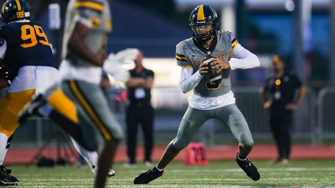 American Heritage Patriots quarterback Dia Bell (3) scrambles in the backfield during the first quarter of a game against the Naples Golden Eagles at Staver Field in Naples on Friday, Sept. 13, 2024.