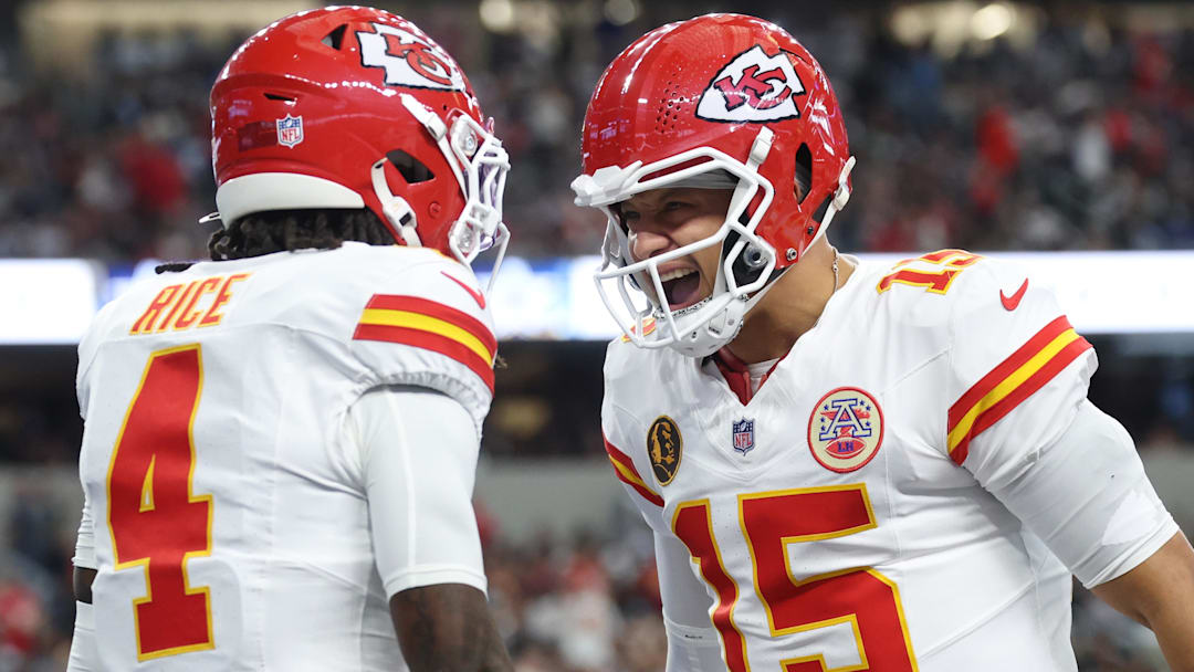 Nov 27, 2025; Arlington, Texas, USA; Kansas City Chiefs wide receiver Rashee Rice (4) and Kansas City Chiefs quarterback Patrick Mahomes (15) celebrate after a play against the Dallas Cowboys during the first quarter at AT&T Stadium. Mandatory Credit: Kevin Jairaj-Imagn Images