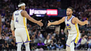 Oct 27, 2023; Sacramento, California, USA; Golden State Warriors guard Stephen Curry (30) celebrates with guard Moses Moody (4) during the fourth quarter against the Sacramento Kings at Golden 1 Center. Mandatory Credit: Sergio Estrada-Imagn Images