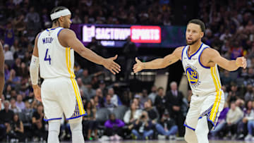 Oct 27, 2023; Sacramento, California, USA; Golden State Warriors guard Stephen Curry (30) celebrates with guard Moses Moody (4) during the fourth quarter against the Sacramento Kings at Golden 1 Center. Mandatory Credit: Sergio Estrada-Imagn Images