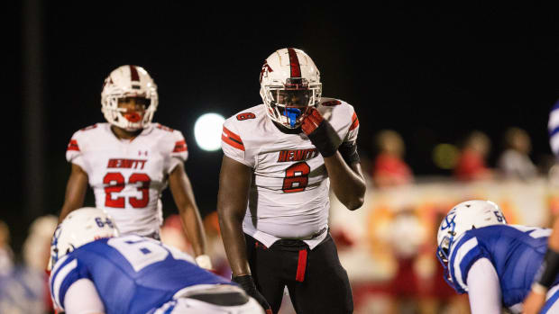 Football player readies for the snap