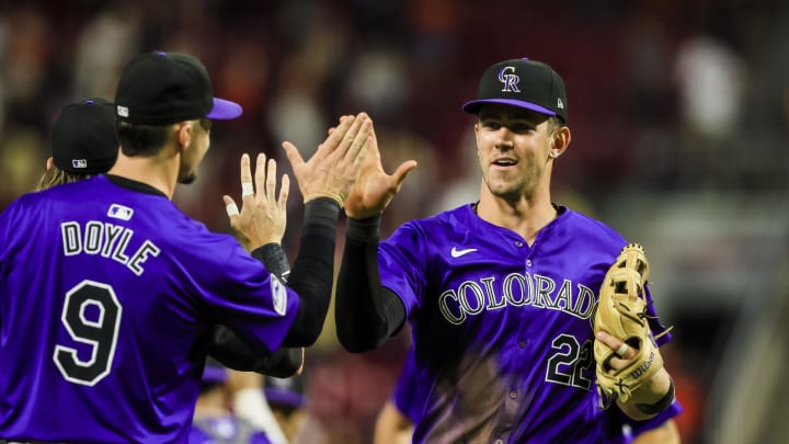 Jul 10, 2024; Cincinnati, Ohio, USA; Colorado Rockies outfielder Nolan Jones (22) high fives designated hitter Brenton Doyle (9) after the victory over the Cincinnati Reds at Great American Ball Park.