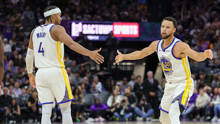 Oct 27, 2023; Sacramento, California, USA; Golden State Warriors guard Stephen Curry (30) celebrates with guard Moses Moody (4) during the fourth quarter against the Sacramento Kings at Golden 1 Center. Mandatory Credit: Sergio Estrada-Imagn Images