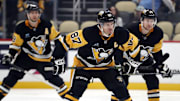 Oct 4, 2024; Pittsburgh, Pennsylvania, USA;  Pittsburgh Penguins center Sidney Crosby (87) prepares for the opening face-off against the Columbus Blue Jackets during the first period at PPG Paints Arena. Mandatory Credit: Charles LeClaire-Imagn Images