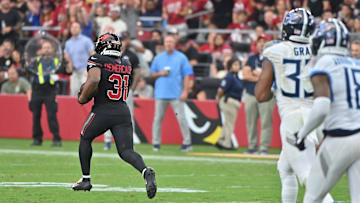 Oct 5, 2025; Glendale, Arizona, USA; Arizona Cardinals running back Emari Demercado (31) runs the ball for 71 yards before fumbling against the Tennessee Titans during the fourth quarter at State Farm Stadium. Mandatory Credit: Matt Kartozian-Imagn Images