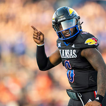 Sep 8, 2023; Lawrence, Kansas, USA; Kansas Jayhawks quarterback Jalon Daniels (6) celebrates after a touchdown against the Illinois Fighting Illini during the first half at David Booth Kansas Memorial Stadium. 