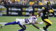 Aug 17, 2024; Pittsburgh, Pennsylvania, USA;  Pittsburgh Steelers running back La'Mical Perine (38) runs the ball against Buffalo Bills cornerback Daequan Hardy (25) during the third quarter at Acrisure Stadium. Buffalo won 9-3. Mandatory Credit: Charles LeClaire-USA TODAY Sports