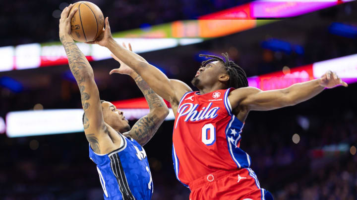 Apr 12, 2024; Philadelphia, Pennsylvania, USA; Philadelphia 76ers guard Tyrese Maxey (0) blocks the shot of Orlando Magic guard Markelle Fultz (20) during the second quarter at Wells Fargo Center. Mandatory Credit: Bill Streicher-USA TODAY Sports