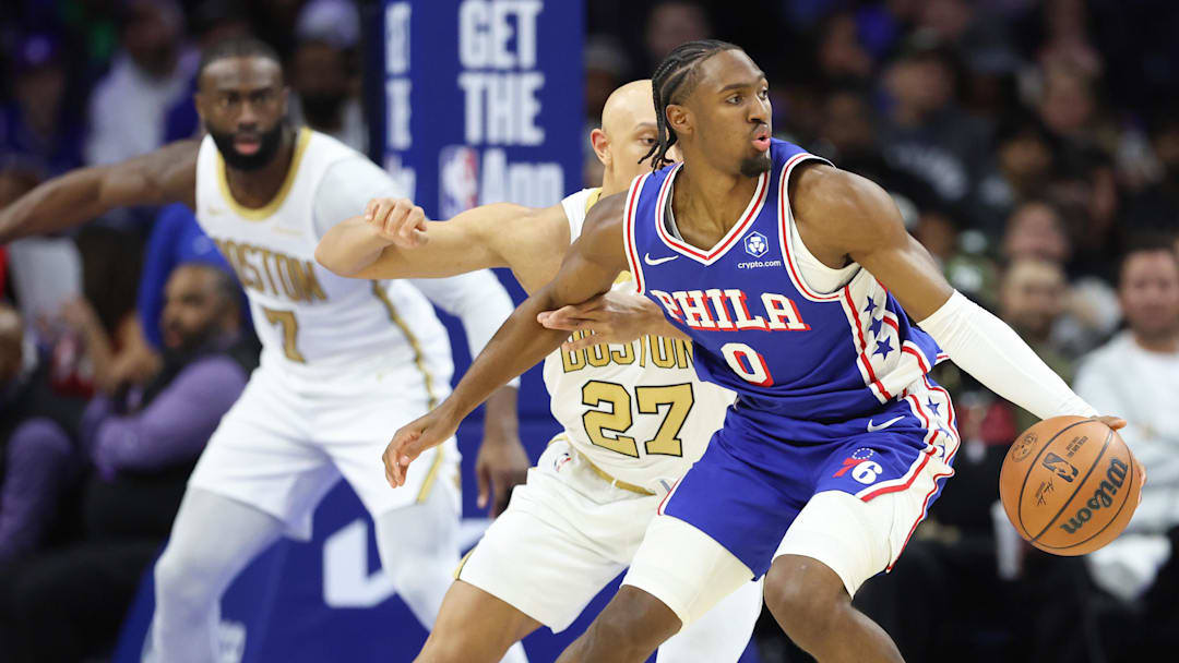 Nov 11, 2025; Philadelphia, Pennsylvania, USA; Philadelphia 76ers guard Tyrese Maxey (0) controls the ball against Boston Celtics guard Jordan Walsh (27) during the second quarter at Xfinity Mobile Arena. Mandatory Credit: Bill Streicher-Imagn Images