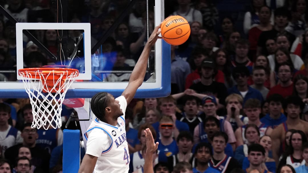 Feb 23, 2026; Lawrence, Kansas, USA; Kansas Jayhawks forward Flory Bidunga (40) blocks the shot of Houston Cougars guard Kingston Flemings (4) during the second half of the game at Allen Fieldhouse. Mandatory Credit: Denny Medley-Imagn Images