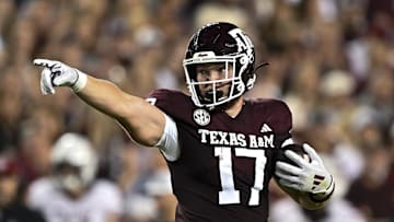 Nov 16, 2024; College Station, Texas, USA; Texas A&M Aggies tight end Theo Melin Ohrstrom (17) motions during the first quarter against the New Mexico State Aggies at Kyle Field. Mandatory Credit: Maria Lysaker-Imagn Images 