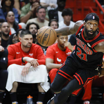 Apr 14, 2023; Miami, Florida, USA; Chicago Bulls guard Patrick Beverley (21) drives to the basket against Miami Heat guard Kyle Lowry (7) during the fourth quarter at Kaseya Center. Mandatory Credit: Sam Navarro-USA TODAY Sports