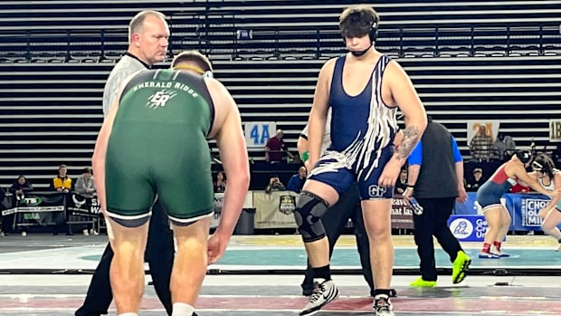 Glacier Peak's Connor Aney won his third Mat Classic 285-pound title in 4A by edging Emerald Ridge's Jesse Mains in 3 OT.