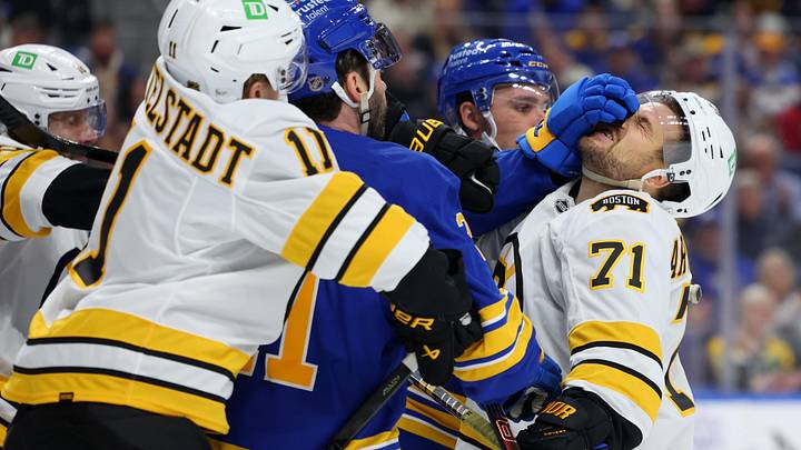 Mar 25, 2026; Buffalo, New York, USA;  The Boston Bruins and the Buffalo Sabres players get into a scrum after the whistle during the first period at KeyBank Center. Mandatory Credit: Timothy T. Ludwig-Imagn Images