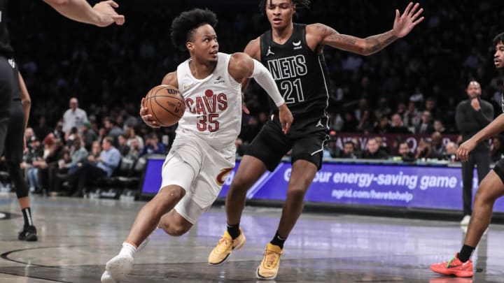 Feb 8, 2024; Brooklyn, New York, USA;  Cleveland Cavaliers forward Isaac Okoro (35) drives past Brooklyn Nets forward Noah Clowney (21) in the second quarter at Barclays Center. Mandatory Credit: Wendell Cruz-USA TODAY Sports