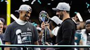 Philadelphia Eagles quarterback Jalen Hurts and head coach Nick Sirianni celebrate with the Vince Lombardi Trophy after defeating the Kansas City Chiefs in Super Bowl LIX 