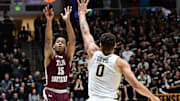 Nov 28, 2023; West Lafayette, Indiana, USA; Texas Southern Tigers guard Zaire Hayes (15) shoots over Purdue Boilermakers forward Mason Gillis (0) during the first half at Mackey Arena. Mandatory Credit: Marc Lebryk-Imagn Images