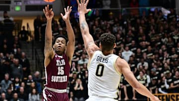 Nov 28, 2023; West Lafayette, Indiana, USA; Texas Southern Tigers guard Zaire Hayes (15) shoots over Purdue Boilermakers forward Mason Gillis (0) during the first half at Mackey Arena. Mandatory Credit: Marc Lebryk-Imagn Images