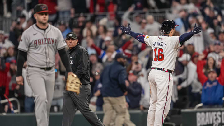 Atlanta Braves catcher Travis d'Arnaud (16) reacts after his game-winning single defeated the Arizona Diamondbacks in extra innings on Friday night. 