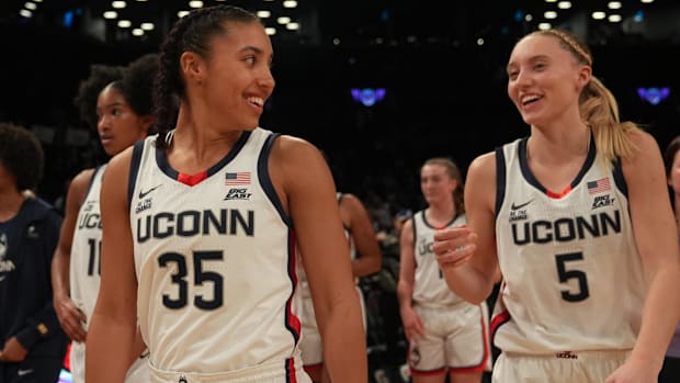 Connecticut Huskies guard Azzi Fudd (35) and Connecticut Huskies guard Paige Bueckers (5) celebrate after the game.